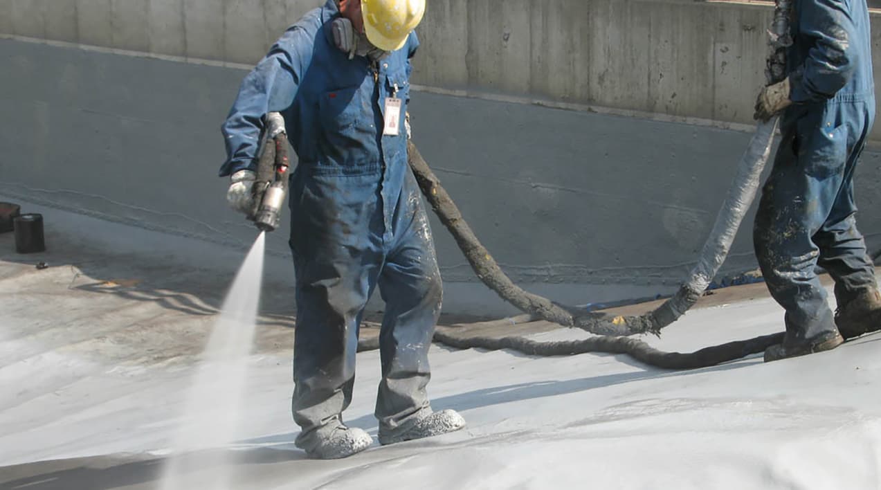 Workers spraying